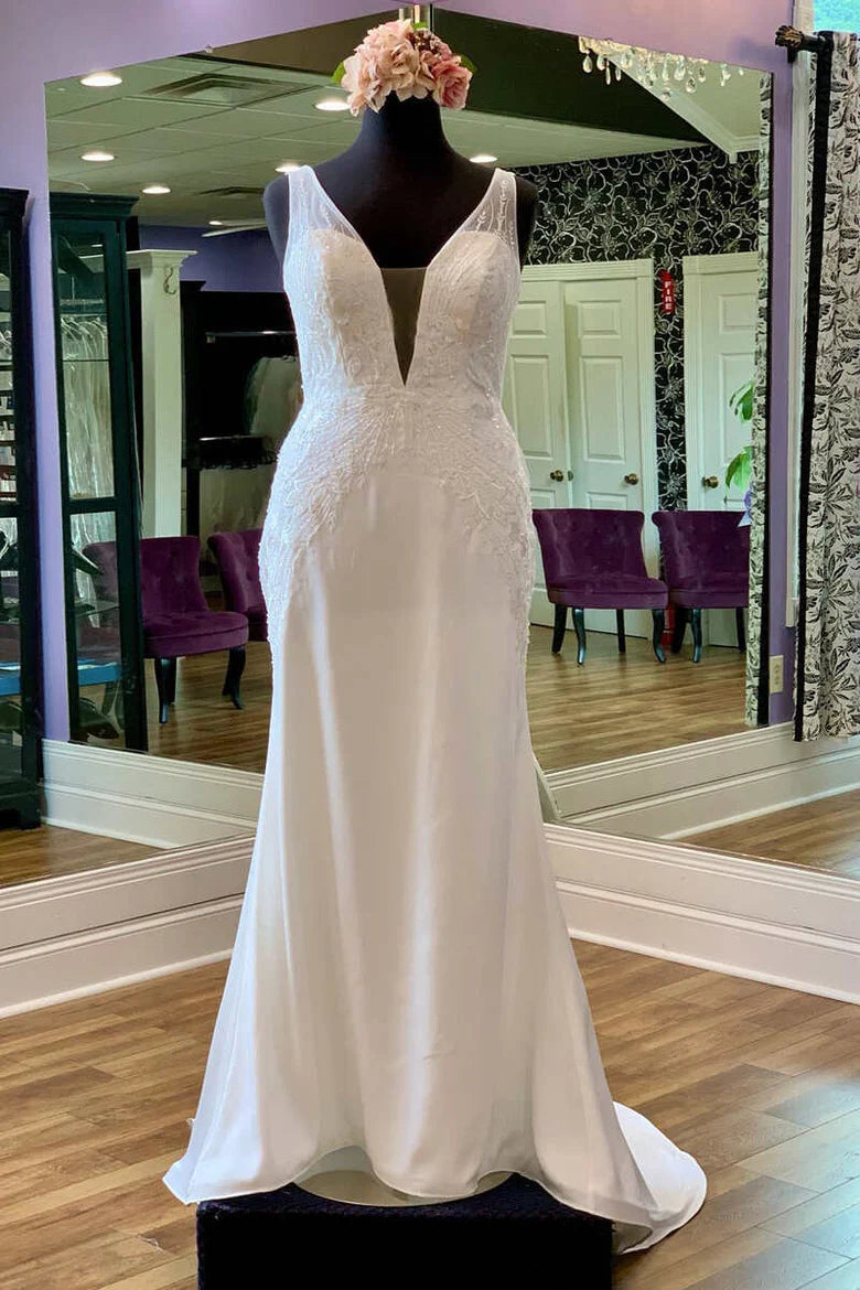 Vestido de novia largo estilo sirena con espalda abierta, tirantes transparentes y apliques